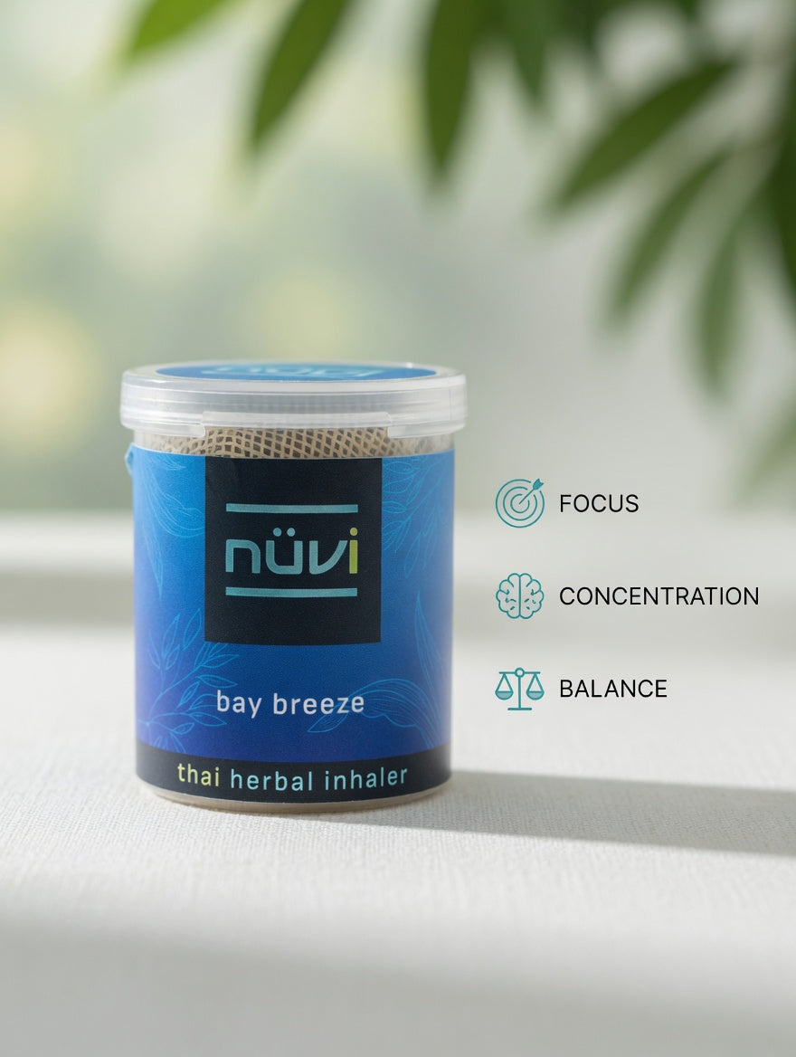 Person using Nuvi Bay Breeze herbal inhaler for focus on the go