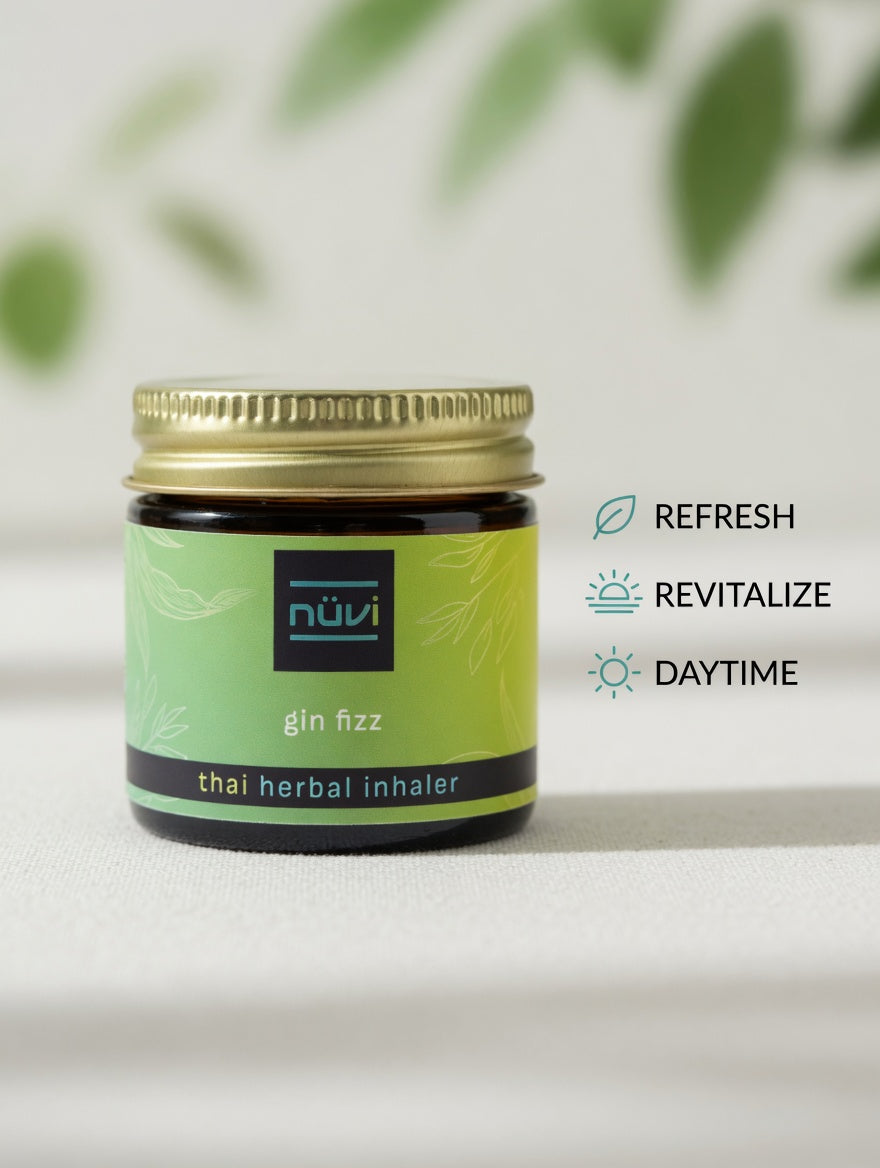 Person using Nuvi Gin Fizz herbal inhaler for a midday refresh