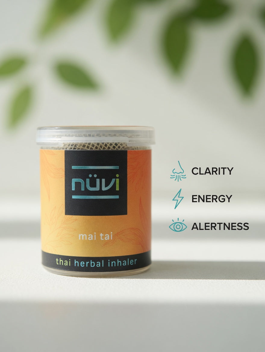 Person using Nuvi Mai Tai herbal inhaler for energy and focus