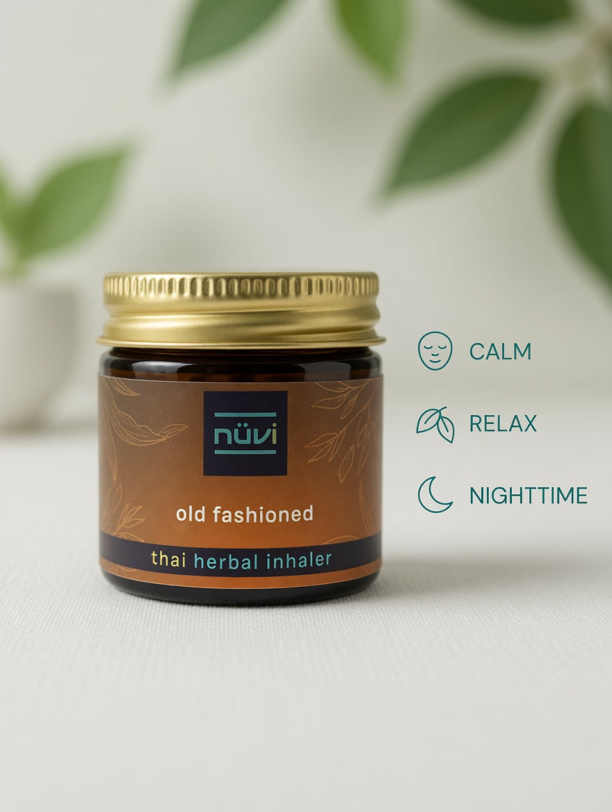 Person using Nuvi Old Fashioned herbal inhaler to unwind and destress